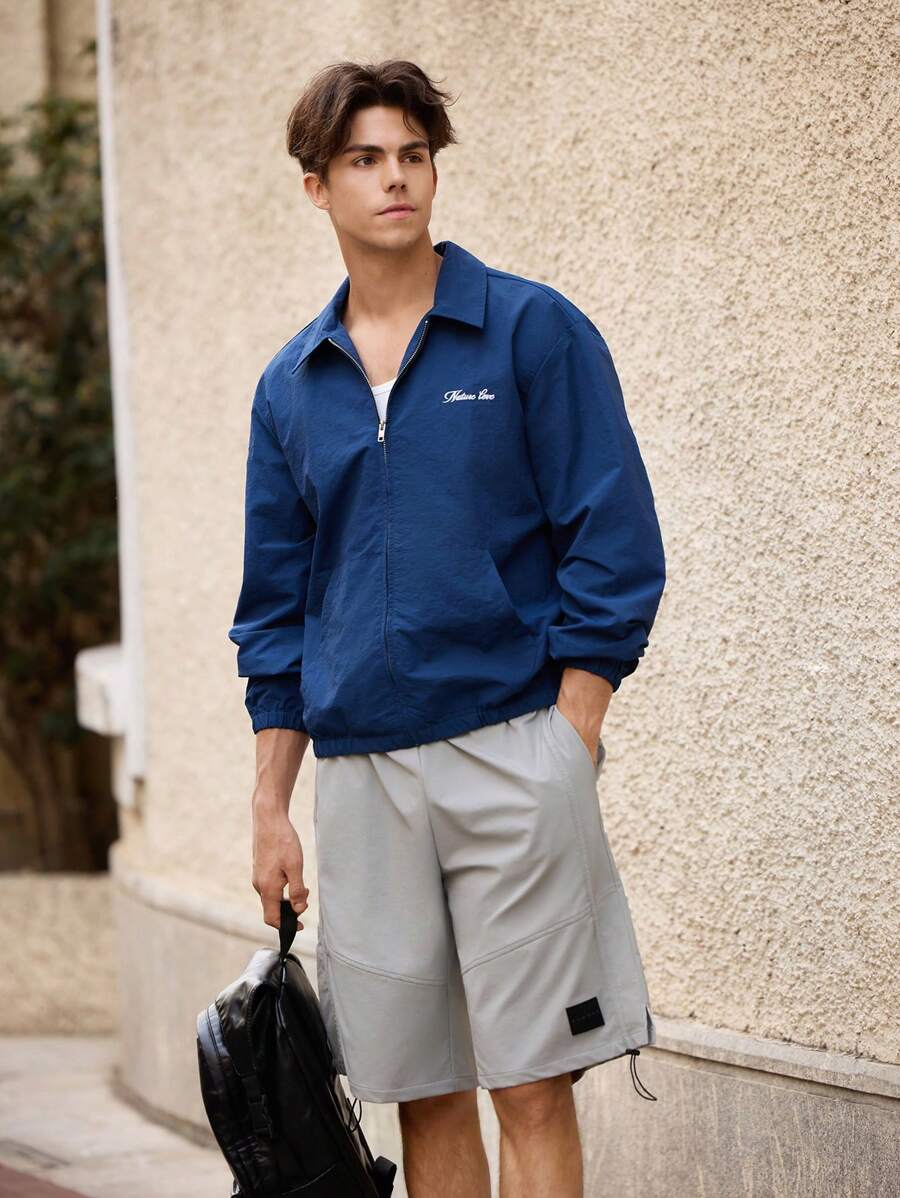 Maija Áo khoác nam màu trơn thêu chữ tối giản giản dị - Màu xanh hải quân - Xem 1