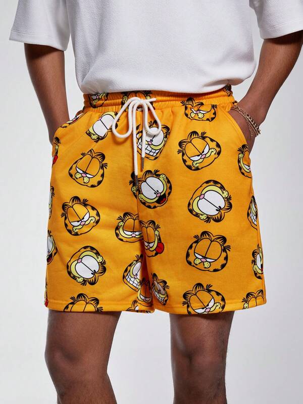 GARFIELD | SHEIN Pantalones cortos amarillos de punto holgados con estampado de gatos todo sobre para hombre, primavera/verano