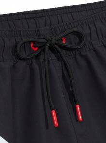 Manfinity Swimmode Shorts de playa para hombre con estampado de letras, cintura con cordón y color contrastante, estilo hawaiano