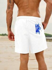 Manfinity VDAYZ Shorts de playa de cintura con cordón con estampado floral para hombres, estilo casual de vacaciones, hawaiano - Azul y blanco - Ver 2