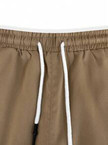 Manfinity Homme Men's Solid Color Flap Pockets Drawstring Waist Cargo Shorts