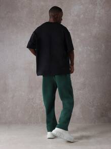 SUMWON Pantalón de chándal esencial de entrepierna caída, de ajuste recto, de rendimiento atlético, de uso diario, con cordón y logo de NY para otoño e invierno