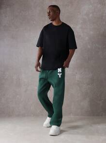 SUMWON Pantalón de chándal esencial de entrepierna caída, de ajuste recto, de rendimiento atlético, de uso diario, con cordón y logo de NY para otoño e invierno
