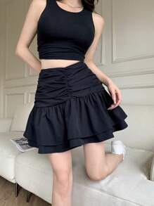 Modelyn Falda pantalón negra casual con pliegues en tela tejida, perfecta para el estilo diario. Esta versátil minifalda con volantes ofrece comodidad y un aspecto elegante.