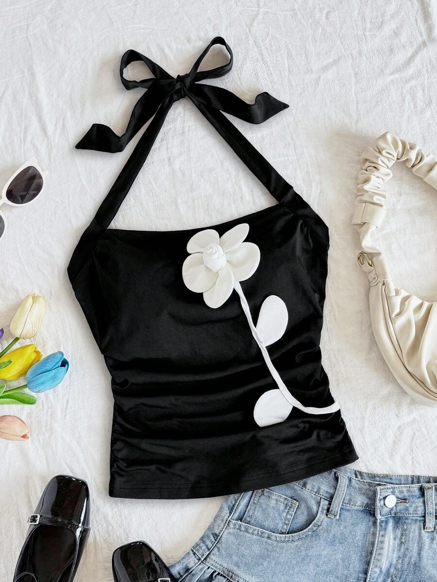 Soleia 女式黑色针织纯色修身挂脖式腰部收褶无袖上衣，配白色撞色花卉贴花