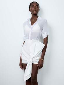 Lumivelle تنورة قصيرة فاشونية للسيدات بألوان صلبة وتصميم فيونكة - أبيض - مشاهدة 3