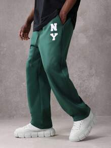 SUMWON Pantalón de chándal esencial de entrepierna caída, de ajuste recto, de rendimiento atlético, de uso diario, con cordón y logo de NY para otoño e invierno