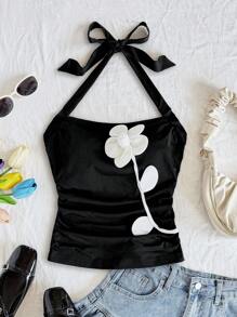 Soleia 女式黑色针织纯色修身挂脖式腰部收褶无袖上衣，配白色撞色花卉贴花