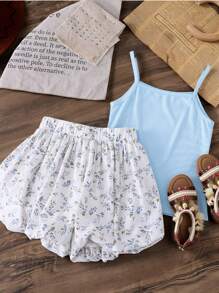 SHEIN Bộ 2 món cho bé gái tuổi mới lớn: Áo hai dây đan thanh lịch dễ thương và chân váy xếp nếp hoa, thích hợp cho kỳ nghỉ, đi học và đi chơi, thích hợp mặc vào mùa xuân và mùa hè, quần áo cao cấp cho bé gái, phong cách công chúa, lý tưởng cho mùa cưới, tập trung vào hoa/trang trí, không có họa tiết truyền thống - Màu xanh lam - Xem 1