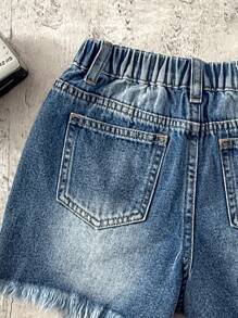 SHEIN Shorts vaqueros rasgados con borde deshilachado y lavado de piedra estilo bohemio para niñas preadolescentes, ropa de verano para niñas, ropa informal y de vacaciones de estilo bohemio para niñas en primavera y verano, atuendos de playa para niñas, ropa de calle occidental para niñas, atuendos de primavera y festivales con shorts vaqueros