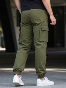 Manfinity Homme Pantalones casuales sueltos de unicolor con bolsillos cargo y cordón en la cintura para hombres