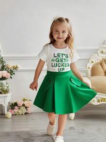 Set de 2 piezas de conjunto informal y lindo para niñas pequeñas, que incluye una blusa de punto de manga corta con cuello redondo y estampado de trébol para la primavera/verano, y una falda plisada de línea A de color liso