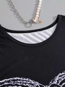 Women's T-Shirt With Digital Printing And Iron-On Technology, Designed As Tight Fitting Bra-Style With Tie Strings And Lace Trim Elements, Fashionable And Retro-Sexy Style, Minimalist Yet Personalized Design, Elegant Fashion, Paired With Jeans For Stylish Look