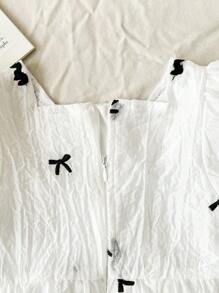 فستان فتيات صغيرات مطبوع برسوم الفراشات بأكمام منتفخة مطبوع بالكامل، مناسب للبنات الصغار للارتداء في جميع المناسبات الصيفية ، نسيج أبيض مع نمط أسود وحاشية دانتيل تجعل الطفلة تبدو أكثر فخامة وجذابة وعذبة - لون مشمشي - مشاهدة 12