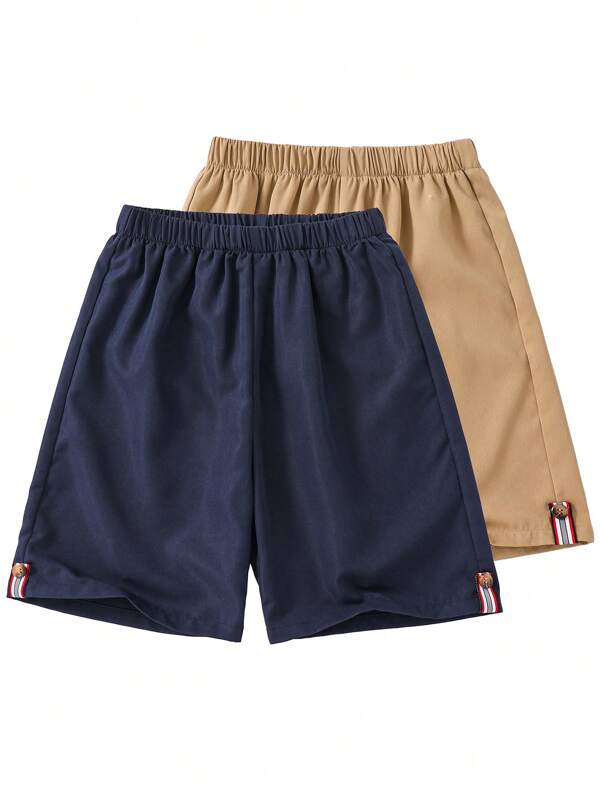 SHEIN Tween Boy Buy One Get One Free 2 Packs Casual Sports College Art Retro Hem Khaki And Royal Blue Shorts With Ribbon And Button Decoration Multi-Pack Suitable For Back To School Suitable For Birthday Parties, Evening Parties, Performances, Weddings, Baptisms, Opening Ceremonies Everyday Suitable For Daily Use Suitable For School Suitable For Travel Suitable For Sports Suitable For Spring And Summer Seasons