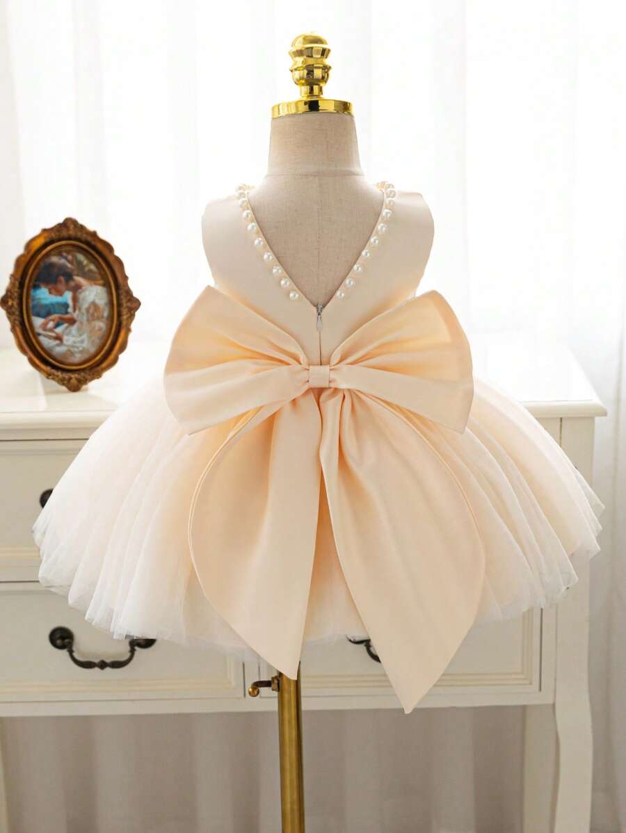 SHEIN Glamorique Kids 圣诞公主女婴礼服薄纱派对伴娘舞会礼服正式舞会礼服，粉色花卉派对婚礼礼服，带 V 形后背大蝴蝶结 - 杏色 - 查看 1