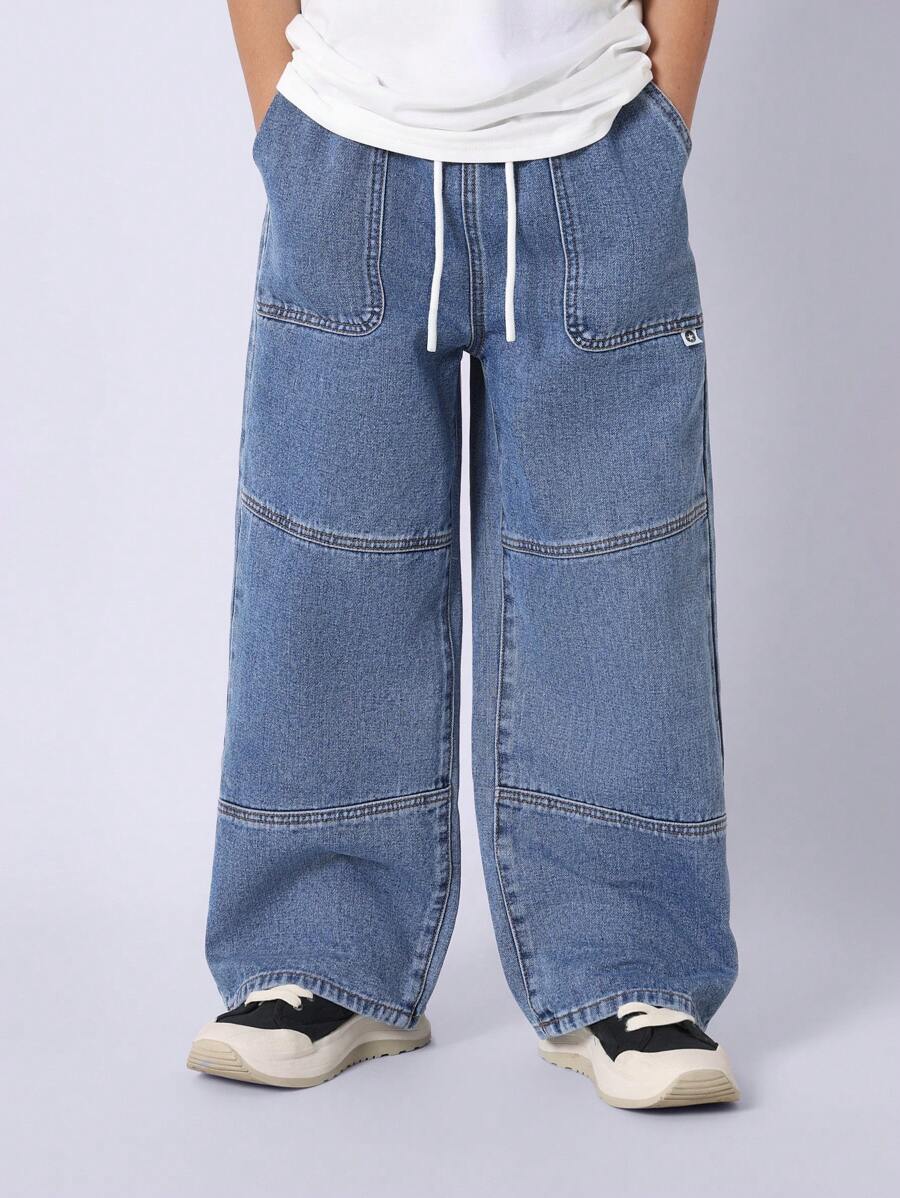 SUMWON Jeans de pierna ancha clásicos para jóvenes con cintura con cordón, diseño de múltiples paneles, comodidad para el día a día, perfectos para la escuela y el uso casual, estilo streetwear - Azul - Ver 1