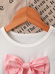 Conjunto rosa para niñas, camiseta blanca con lazo de strass desmontable, de moda y lindo, de tejido de punto, suave y cómodo, combinado con falda de pastel con volantes, cómodo y elegante, esencial para salidas de primavera/verano