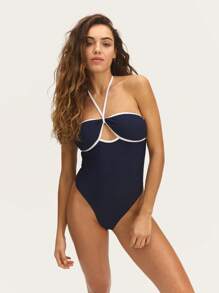 Nöista Halter One-Piece Swimsuit 
Dive Into Fun With Our Stunning Halter One-Piece Swimsuit Featuring Contrast Colors And Removable Pads, Designed For A Flattering Fit!