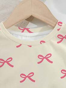 SHEIN Bộ đồ hai mảnh in nơ màu hồng dễ thương và ngọt ngào, màu hồng, áo phông tay ngắn đơn giản thường ngày cho bé gái tuổi teen, phù hợp cho mùa hè - Nhiều màu - Xem 4