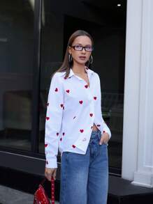 RueChic Blusa donna con bottoni, maniche lunghe, con ricamo a cuore intrecciato, di colore unito, per uscite