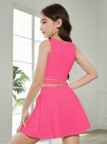 SHEIN Ensemble 2 pièces pour pré-adolescentes, comprenant un débardeur de sport et une jupe de tennis, en fuchsia unicolore, minimaliste et confortable. Tenue de sport polyvalente pour le campus, style élégant avec taille haute, coupe ajustée et allongeante, en tissu stretch. - Rose vif - Voir 2