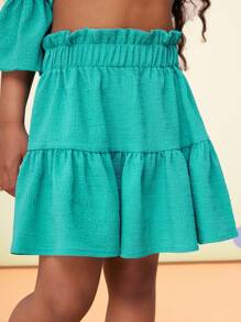 Conjunto de 2 piezas para niña joven con top de hombros descubiertos de manga abullonada y falda mini en color sólido