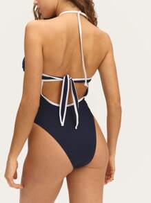 Nöista Halter One-Piece Swimsuit 
Dive Into Fun With Our Stunning Halter One-Piece Swimsuit Featuring Contrast Colors And Removable Pads, Designed For A Flattering Fit!