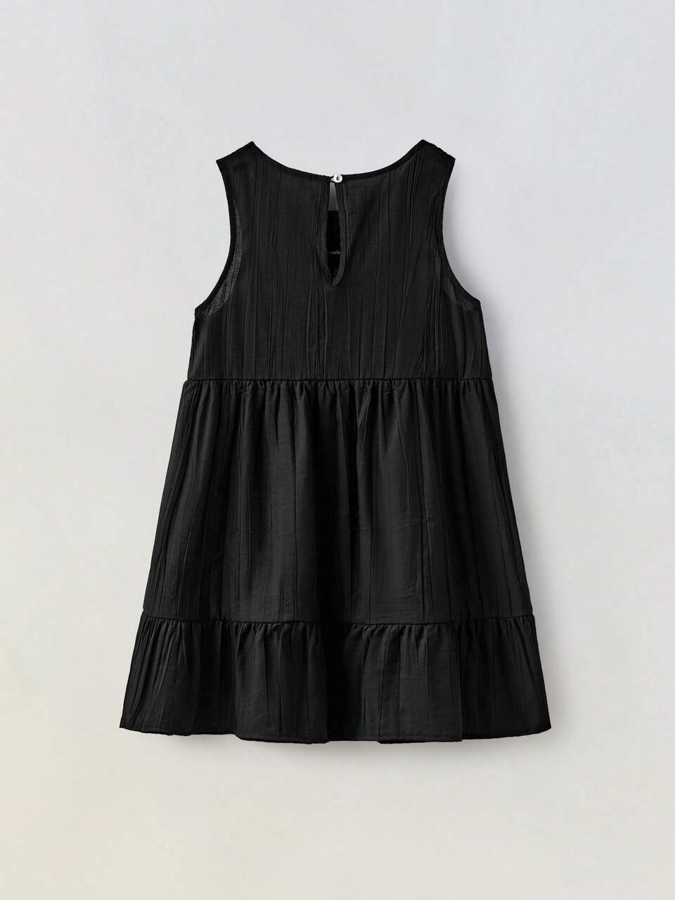 Vestido informal suelto de niña joven con bloque de color y decoración de lazo