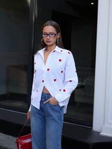 RueChic Blusa donna con bottoni, maniche lunghe, con ricamo a cuore intrecciato, di colore unito, per uscite