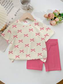SHEIN Bộ đồ hai mảnh in nơ màu hồng dễ thương và ngọt ngào, màu hồng, áo phông tay ngắn đơn giản thường ngày cho bé gái tuổi teen, phù hợp cho mùa hè - Nhiều màu - Xem 2