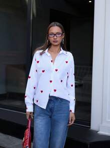 RueChic Blusa donna con bottoni, maniche lunghe, con ricamo a cuore intrecciato, di colore unito, per uscite