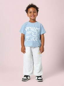 SUMWON Camiseta gráfica de arte callejero con estampado de oso de peluche de Brooklyn, de cuello redondo, estilo urban streetwear casual de verano, moda juvenil de estilo hip hop cool