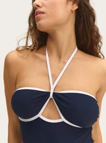 Nöista Halter One-Piece Swimsuit 
Dive Into Fun With Our Stunning Halter One-Piece Swimsuit Featuring Contrast Colors And Removable Pads, Designed For A Flattering Fit!