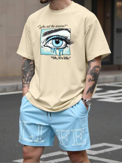 Manfinity LEGND Plus Size Men's T-Shirt Set, Young Street Style Outfit For Men. The T-Shirt Has A Large, Pop Art Stylized Eye Graphic. The Graphic Also Has Letter Spelling "LIFE". The Loose Khaki T-Shirt Is Paired With Light Blue Shorts, Creating A Casual, Fashionable And Artistic Look, A Perfect Streetwear Item, Also Makes A Great Gift For Boyfriend Or Husband. Men's Shorts Set, Men's 2 Pieces Set, Travel Suit.