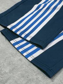 男士撞色条纹格纹拼接抽绳腰带运动裤，适合狂欢