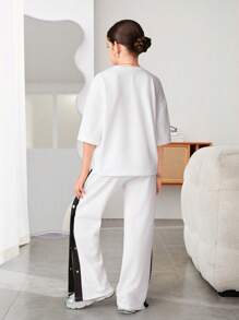 2pcs/Set Girls Casual All-Match Versatile Letter Drop Shoulder Loose T-Shirt + Contrast Button Slit Knit Pants Set, For Sports & School