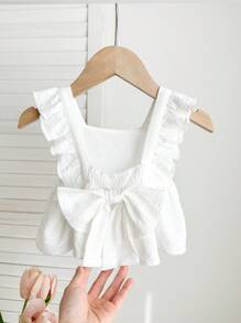 Blusa blanca casual y texturizada con lazo para bebés niñas, versátil para el verano