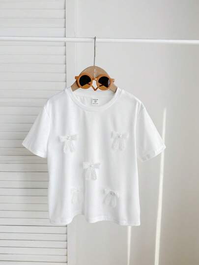 SHEIN Tween Girls 可爱 3D 蝴蝶结设计白色 T 恤，百搭休闲日常穿着，适合任何场合