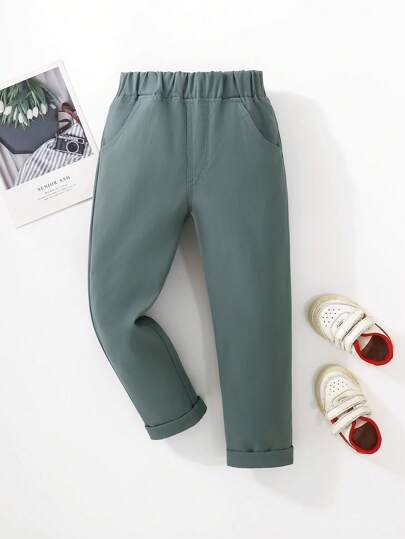 SHEIN Young Boy Solid Color Elastic Waist Pockets Tapered Casual Pants