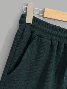 RueChic Conjunto de camiseta regular y pantalón corto de tela tipo gofre para hombres