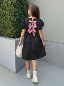 Vestido con mangas abullonadas, acampanado, de color negro y rosa con contraste, recorte calado y decoración de lazo para niña preadolescente Nova Glow, de moda y versátil para salidas, hogar, escuela, primavera/verano