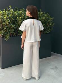 SHEIN Nova Glow Tween Girls Casual Commuter Black & White Contrast Bow Decor Short Sleeve Top And Leggings 2 Pieces Set