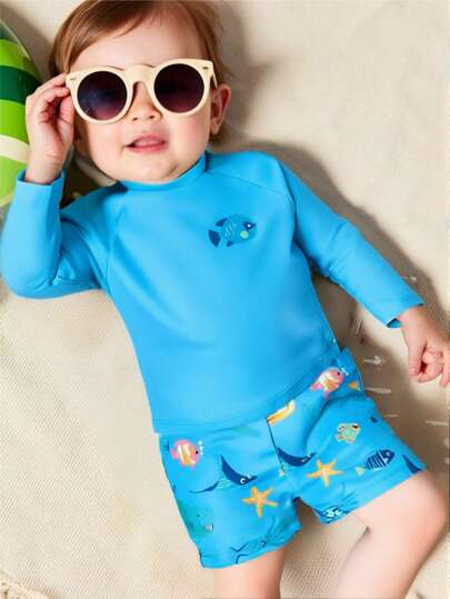 SHEIN 幼儿男孩/女孩 2 件套：柔软针织蓝色卡通鲨鱼印花圆领套头长袖上衣和松紧腰短裤，适合度假、海滩、游泳