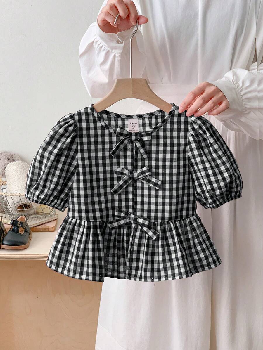 SHEIN LMoss Kids 年轻女孩春夏舒适红色格子编织蝴蝶结细节泡泡袖衬衫,适合情人节、学校日常穿着、度假和节假日、妈妈和女儿和姐妹搭配。 - 黑色 - 查看 1