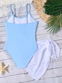 青春期前女孩纯蓝色连体泳衣，带蝴蝶结装饰和白色网眼裙