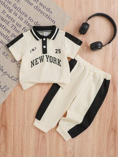 男婴POLO领搭配撞色标志性图案套装，兼具时尚与舒适，专为爱玩的宝宝设计。POLO领设计提升了宝宝整体的优雅气质，标志性图案则增添了趣味和教育元素。撞色设计让套装更加活泼有趣，是宝宝日常穿着的理想之选。