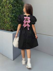 Vestido con mangas abullonadas, acampanado, de color negro y rosa con contraste, recorte calado y decoración de lazo para niña preadolescente Nova Glow, de moda y versátil para salidas, hogar, escuela, primavera/verano