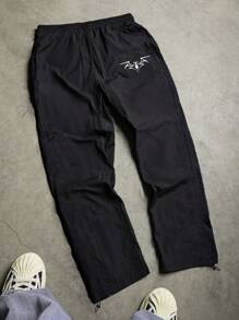 Manfinity Sport Corelite Pantalones deportivos casuales para hombres con estampado de araña y cintura con cordón - Negro - Ver 1