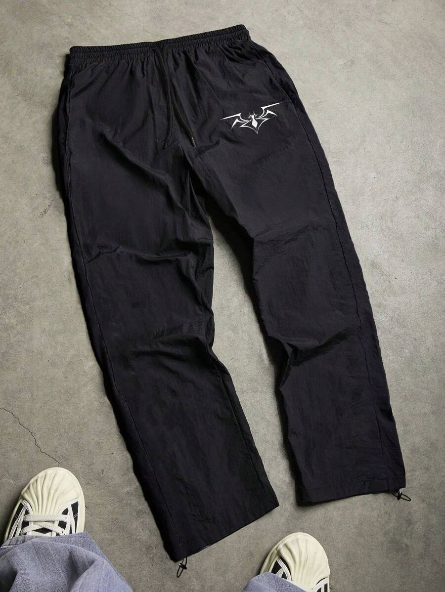 Manfinity Sport Corelite Pantalones deportivos casuales para hombres con estampado de araña y cintura con cordón - Negro - Ver 1